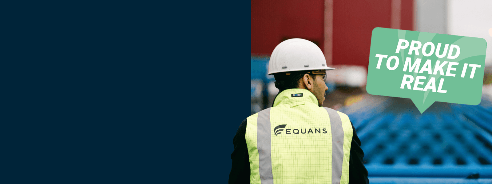 Equans engineer in a hard hat and hi-vis vest beside a 'Proud to make it real' sign
